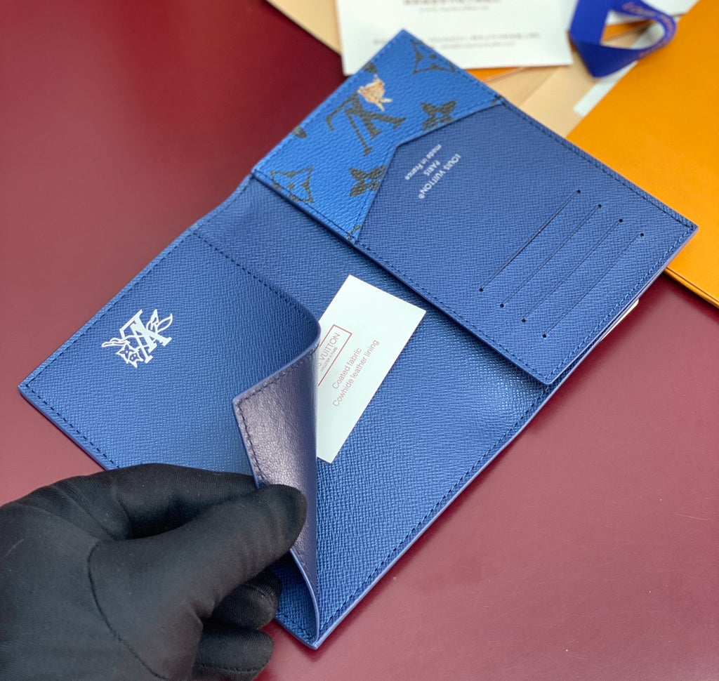 Blue Louis Vuitton small bag with logo emblem and fold-over flap