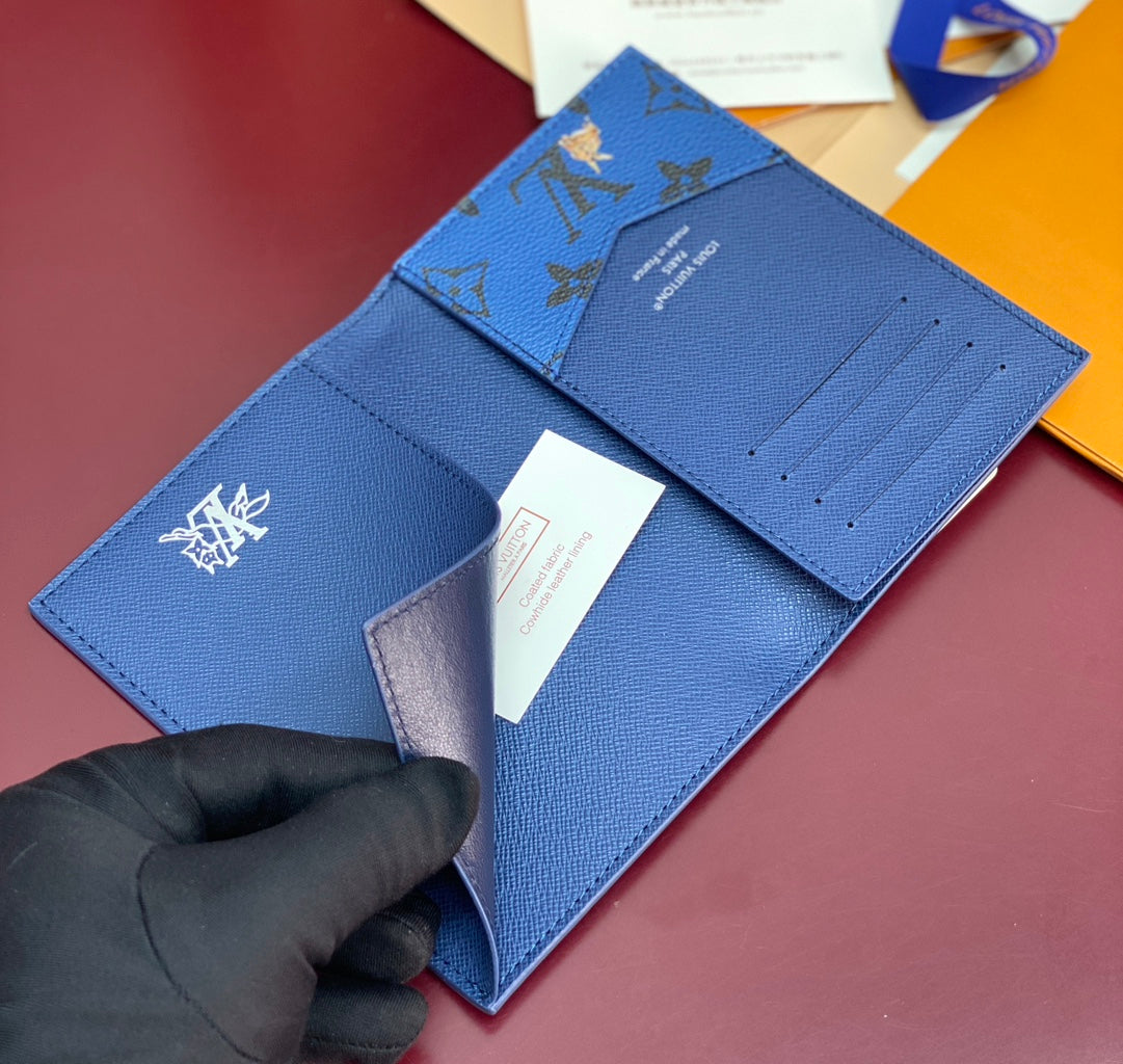 Blue Louis Vuitton small bag with logo emblem and fold-over flap