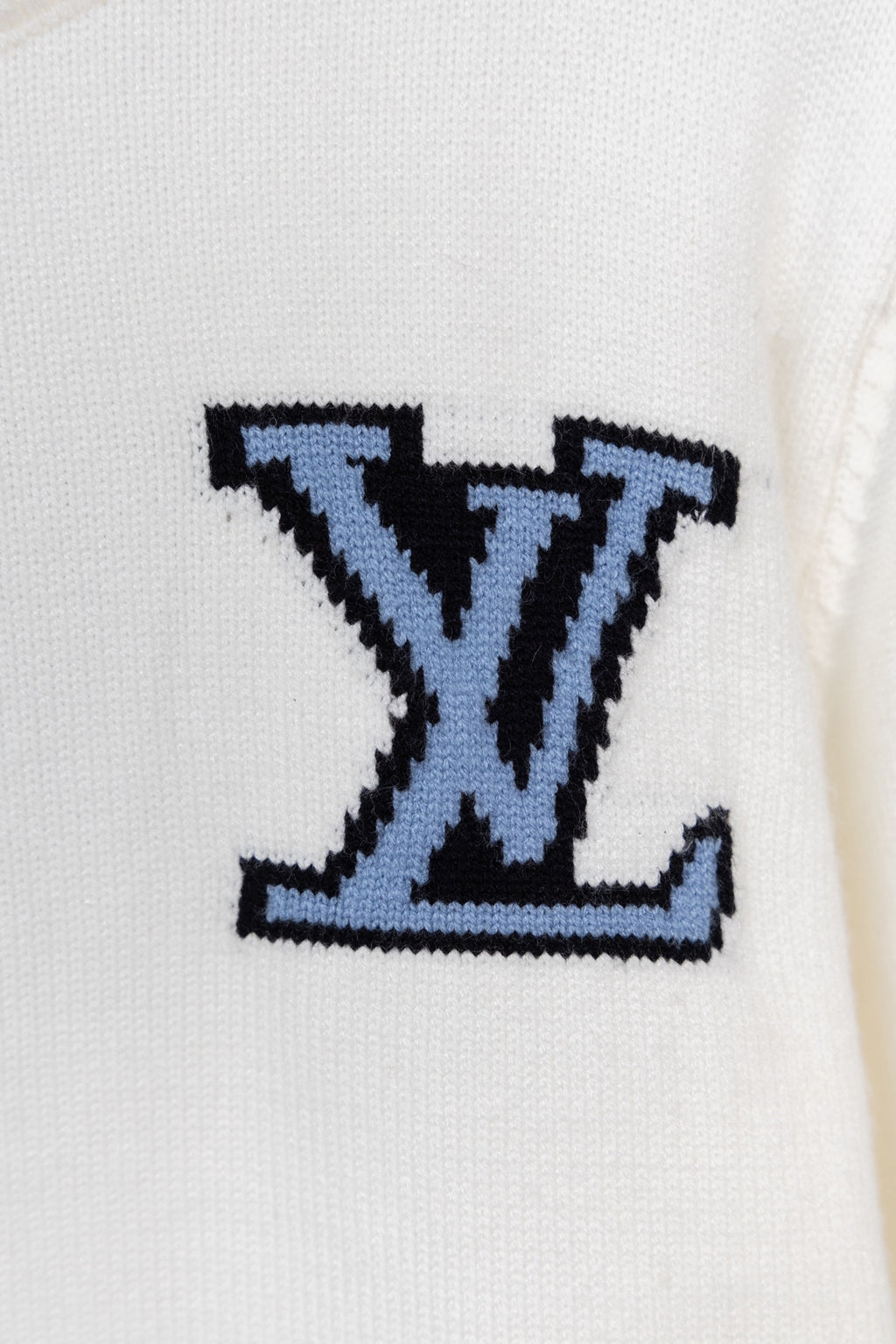 Blue LV-style logo on white knit sweater front