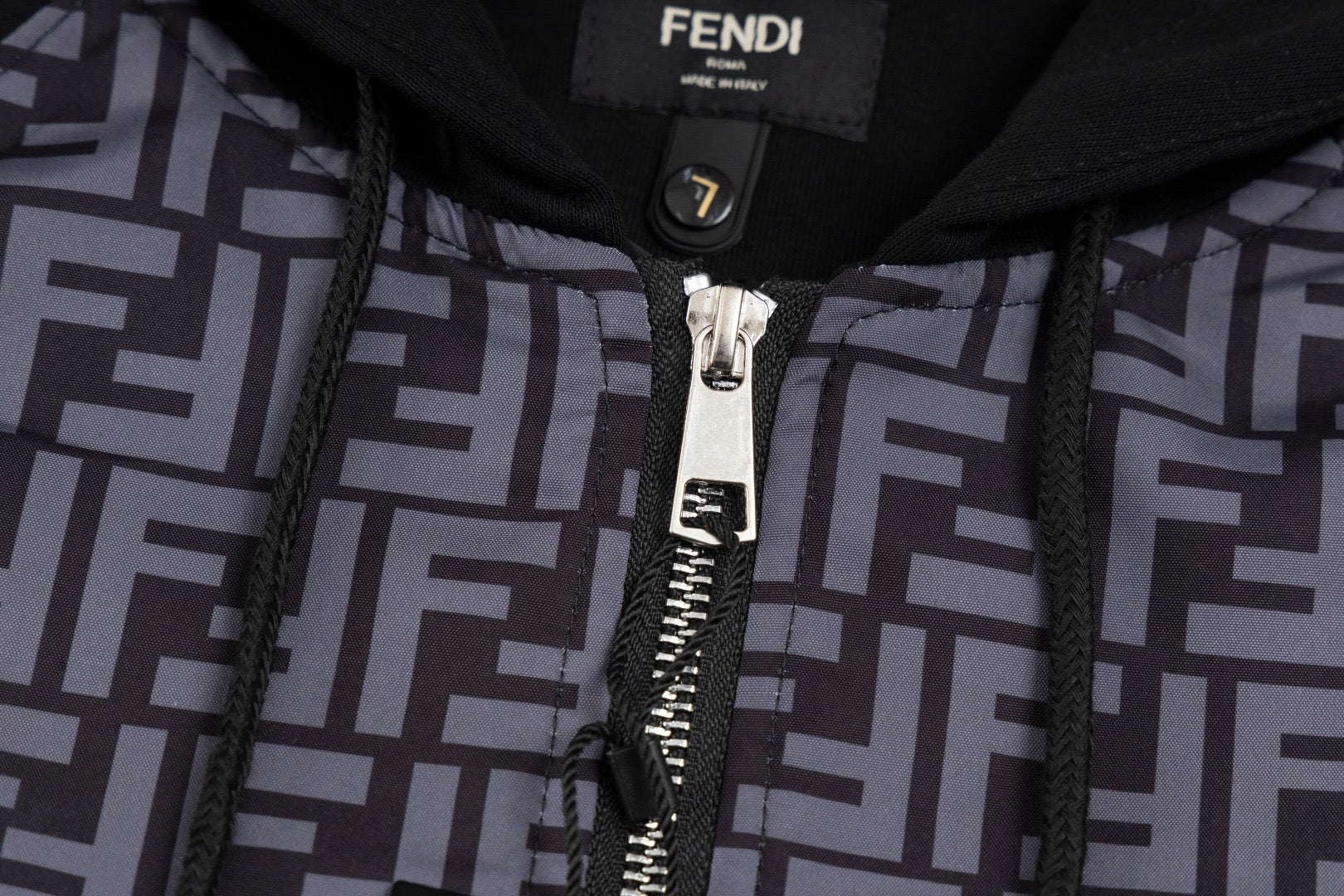 Zip hoodie front with FF monogram panels, silver zipper, and black trim