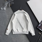 White sweatshirt back view with small sleeve cuff logo patch