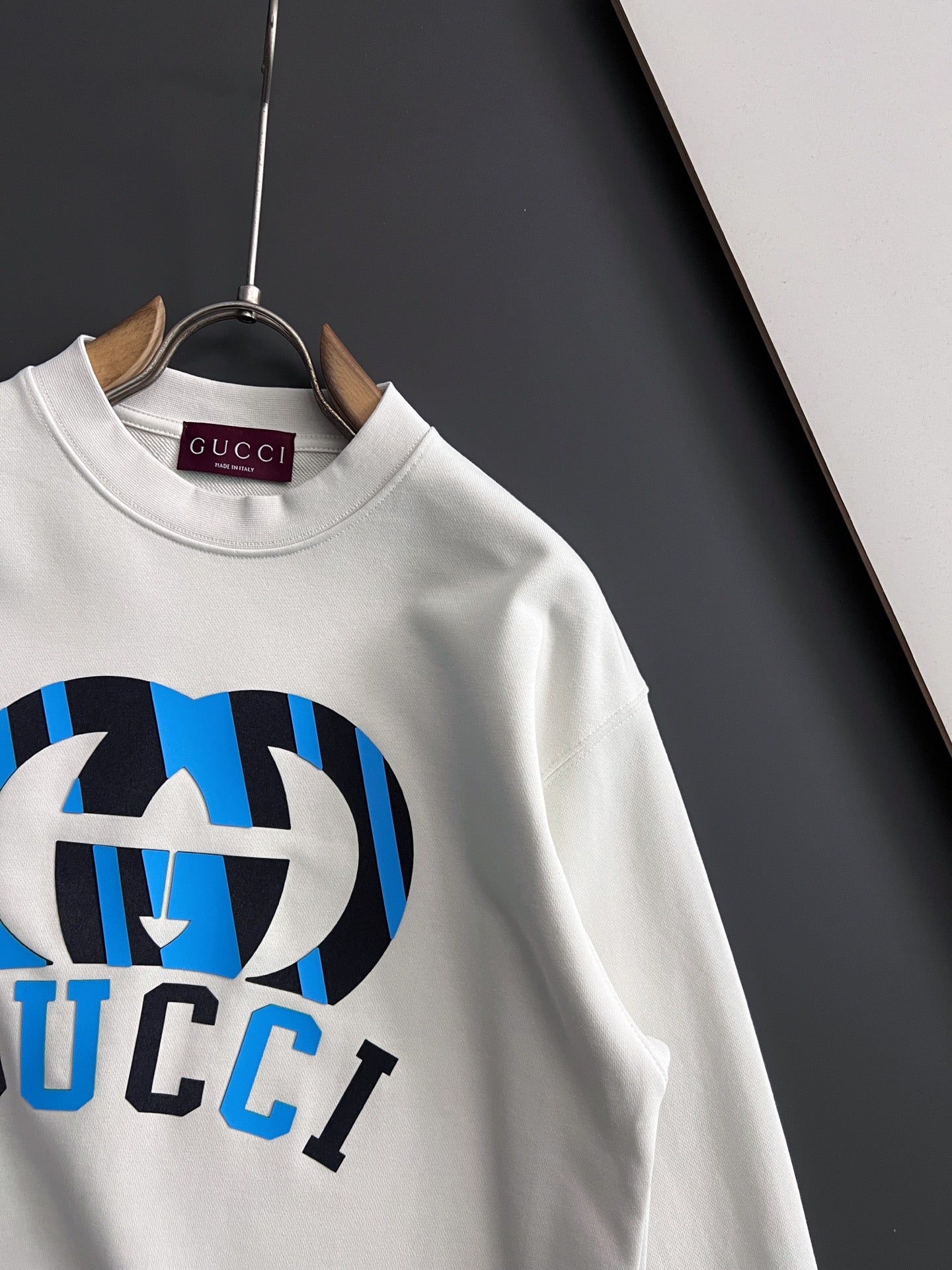 White sweatshirt with side logo print and ribbed crew neckline detail