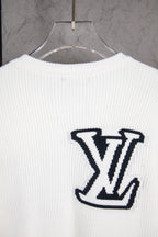 White long-sleeve knit sweater with centered navy LV logo on back