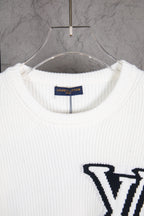 White ribbed knit sweater neckline with Louis Vuitton label