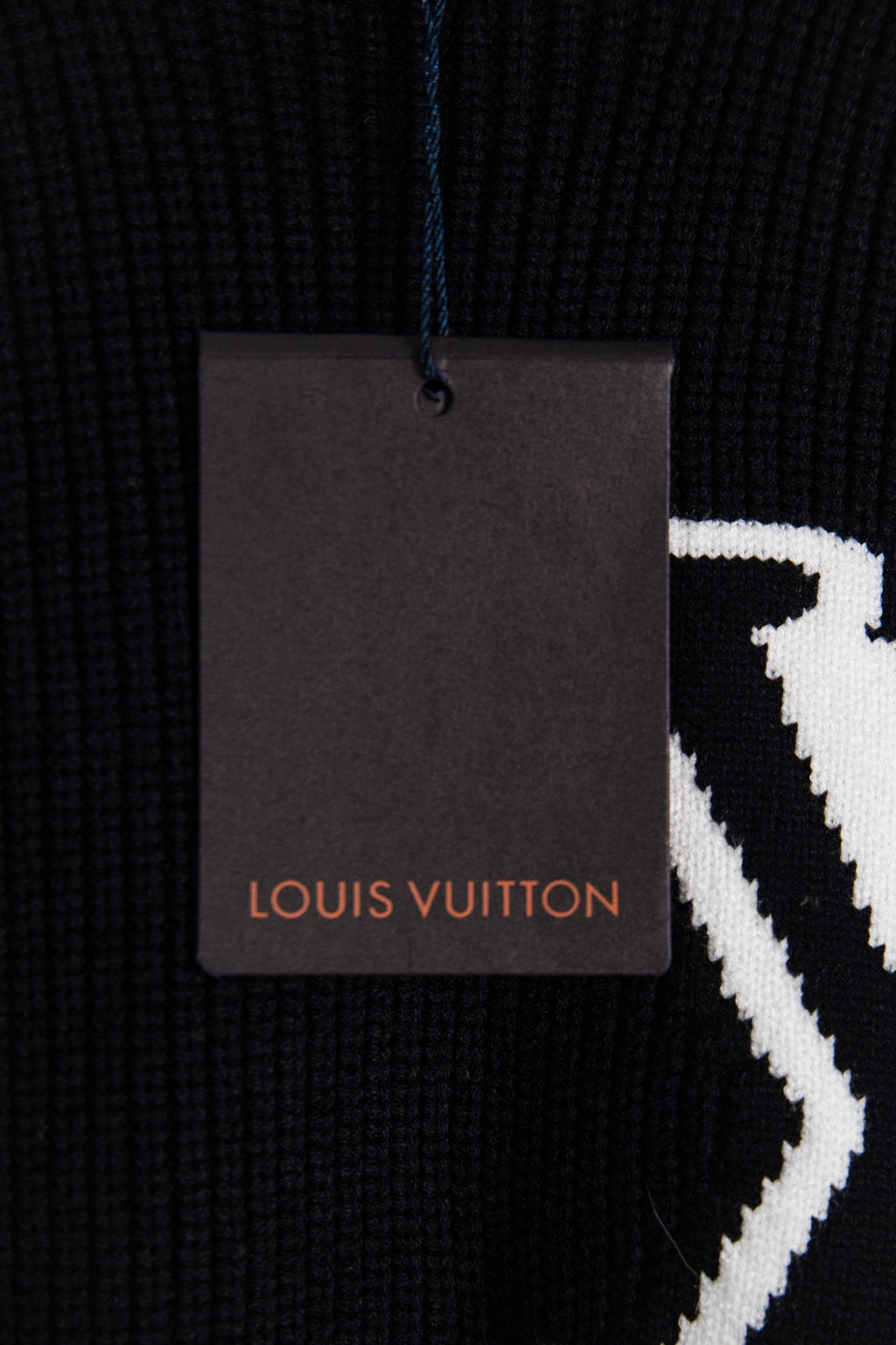 Dark navy sweater fabric with Louis Vuitton hang tag