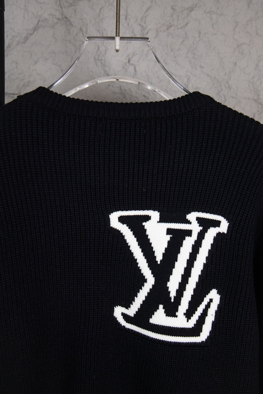 Dark navy sweater back with centered white LV logo