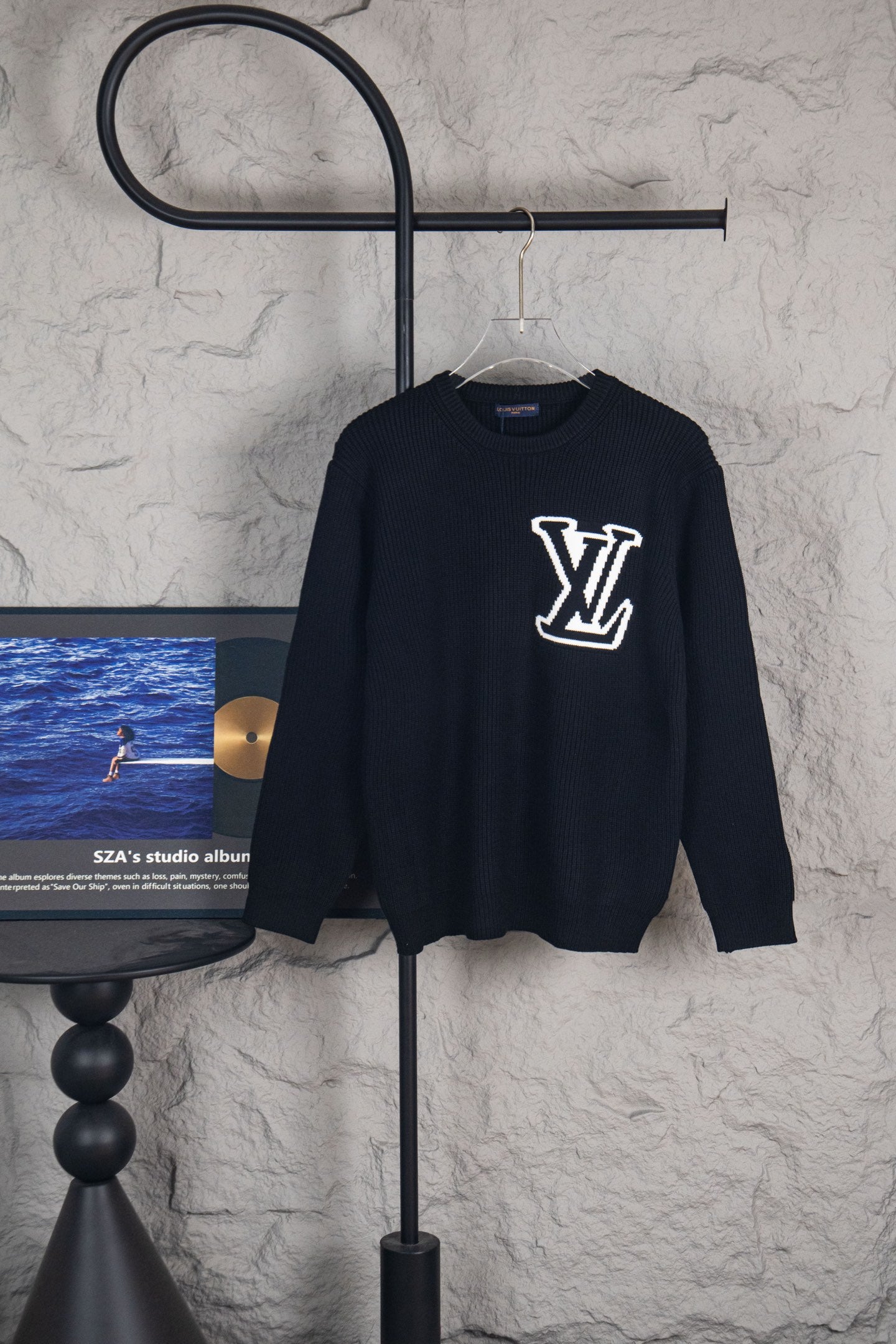Dark navy long-sleeve sweater with white LV logo on front