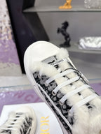 Dior sneaker with black patterned side panel, white laces, and fluffy inner trim