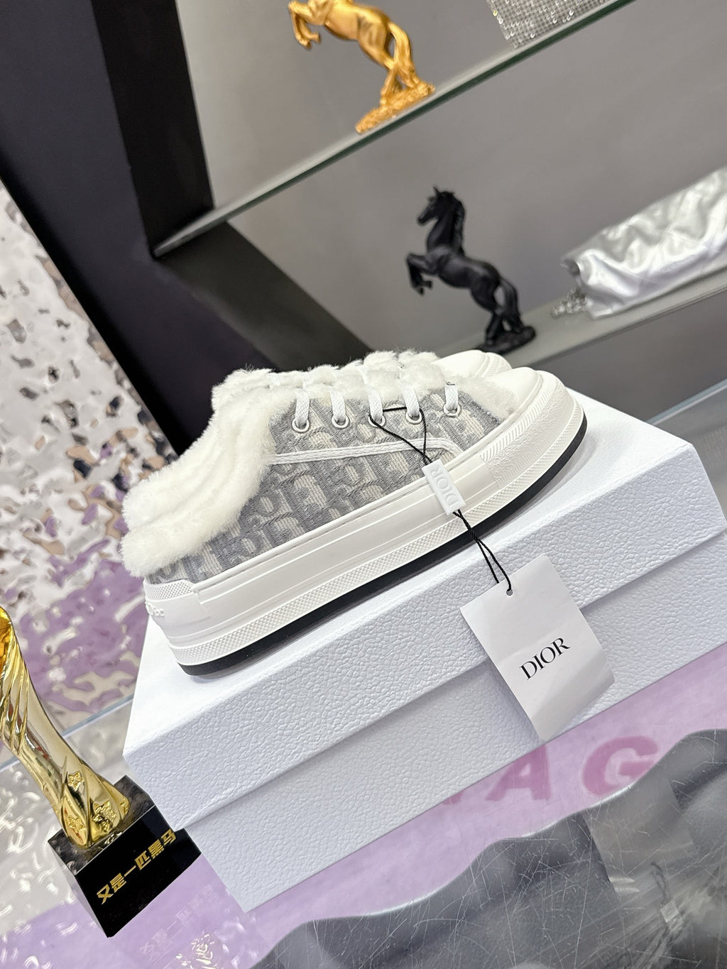 Dior women’s high-top sneakers, white laces and gray monogram fabric with fur collar