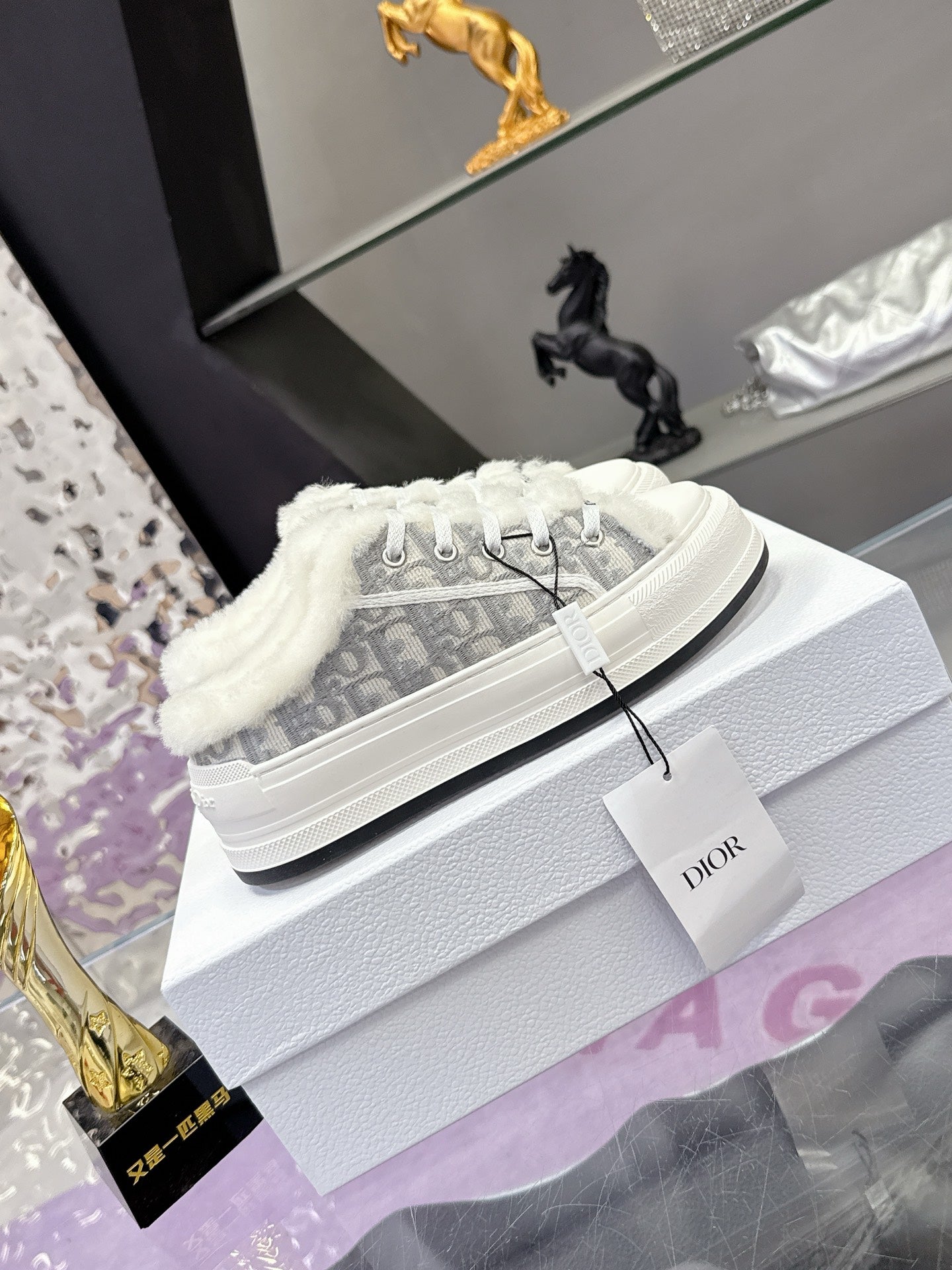 Dior women’s high-top sneakers, white laces and gray monogram fabric with fur collar