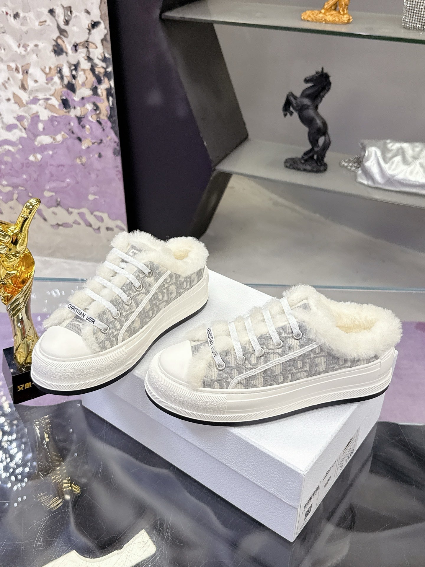 Dior women’s high-top sneakers, pair view in white with gray patterned uppers and fur trim