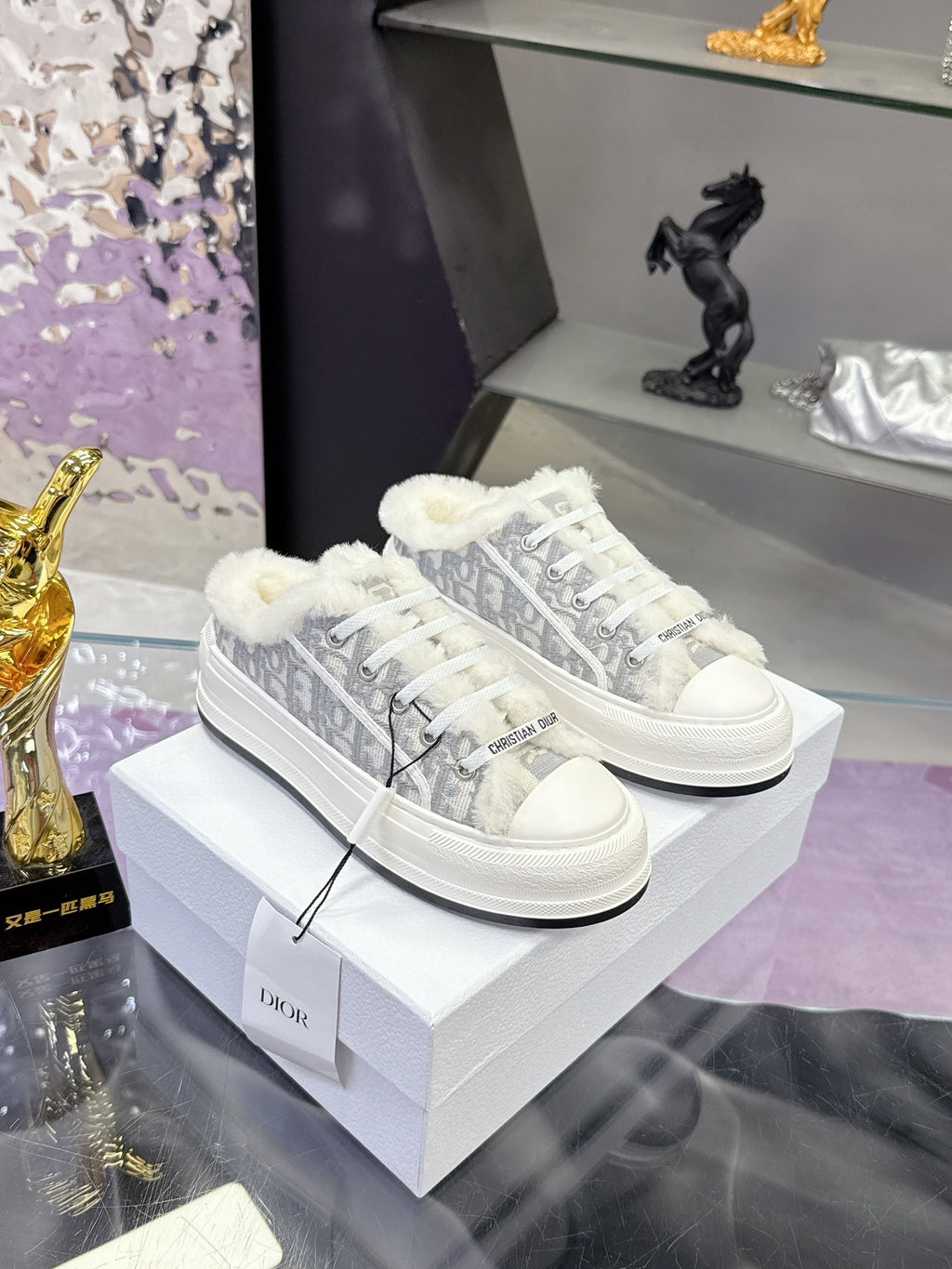 Dior women’s high-top sneakers in white with gray logo-print and faux-fur trim