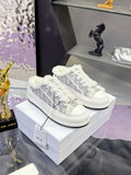Dior women’s high-top sneakers in white with gray logo-print and faux-fur trim