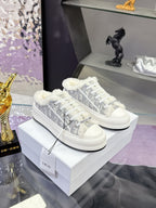 Dior women’s high-top sneakers in white with gray logo-print and faux-fur trim
