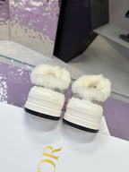 Dior women’s sneaker heels, white soles with gray logo uppers and faux-fur trim