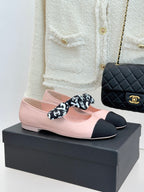 Chanel logo bow ballet flats in blush pink with black toe and heel caps