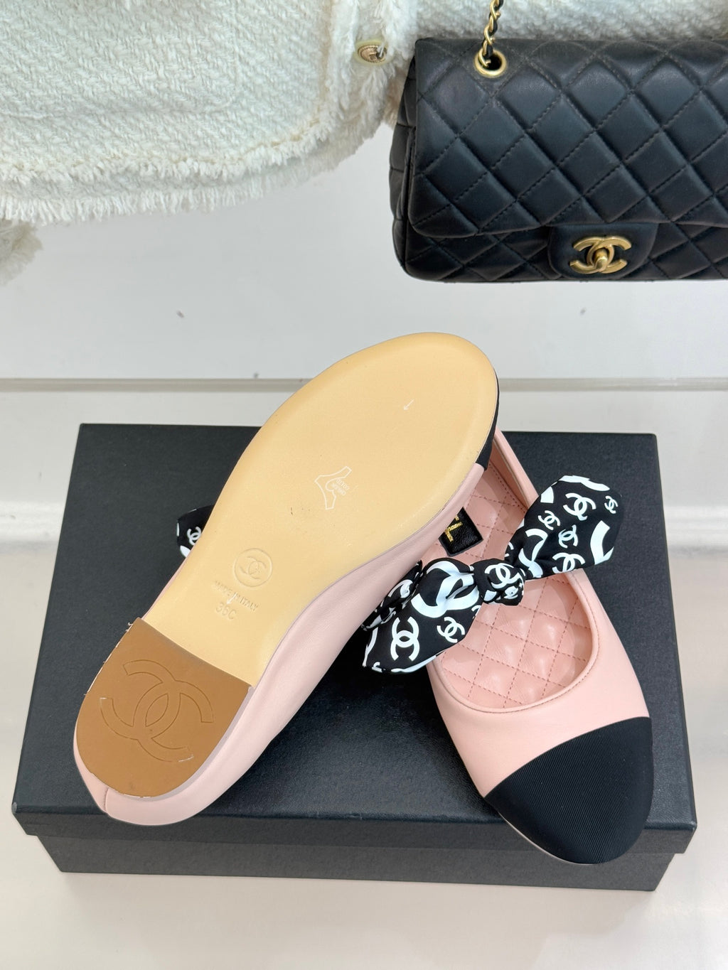 Chanel logo bow ballet flat in blush pink with black toe panel and outsole