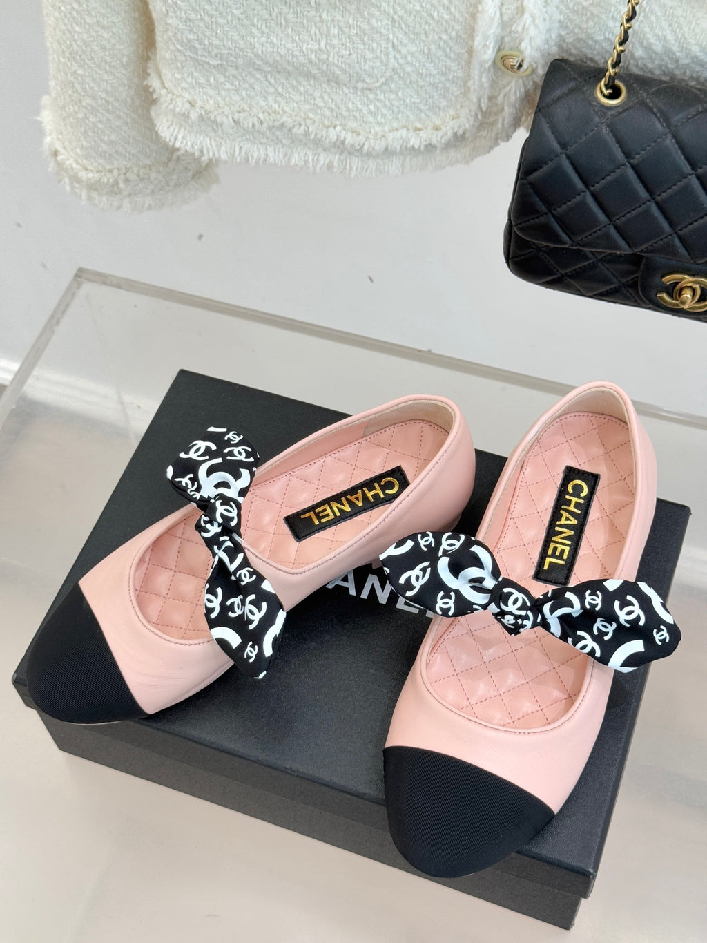 Chanel logo bow ballet flats, blush pink leather upper with black accents