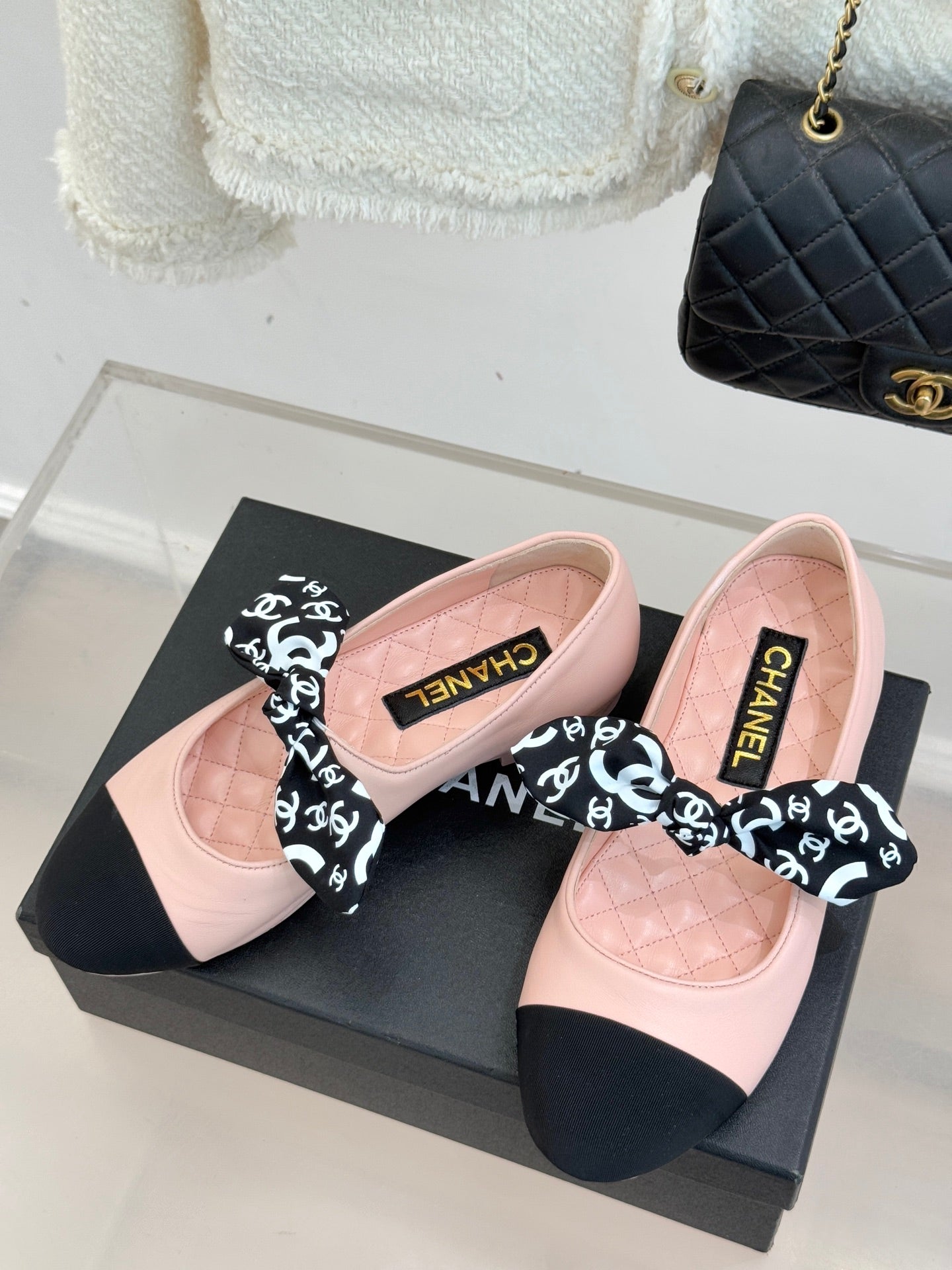 Chanel logo bow ballet flats, blush pink leather upper with black accents