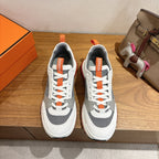 Hermes unisex sneakers, white with gray panels and orange laces