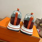 Hermes unisex luxury sneakers from the heel: teal uppers with burgundy and white sole