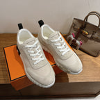 Hermes unisex sneakers, off-white canvas upper with textured sole and white laces