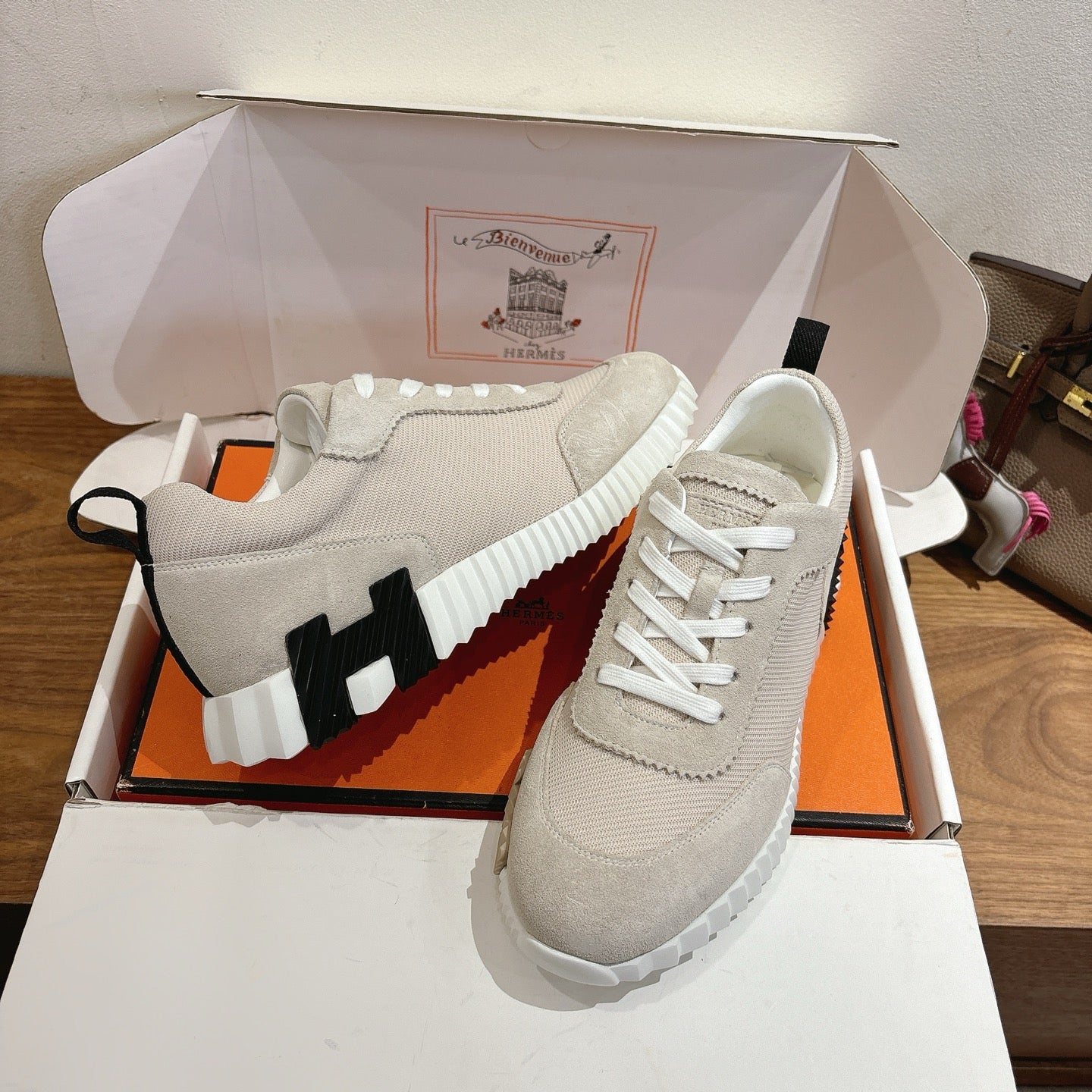 Hermes unisex sneakers, off-white upper with white laces and black logo detailing
