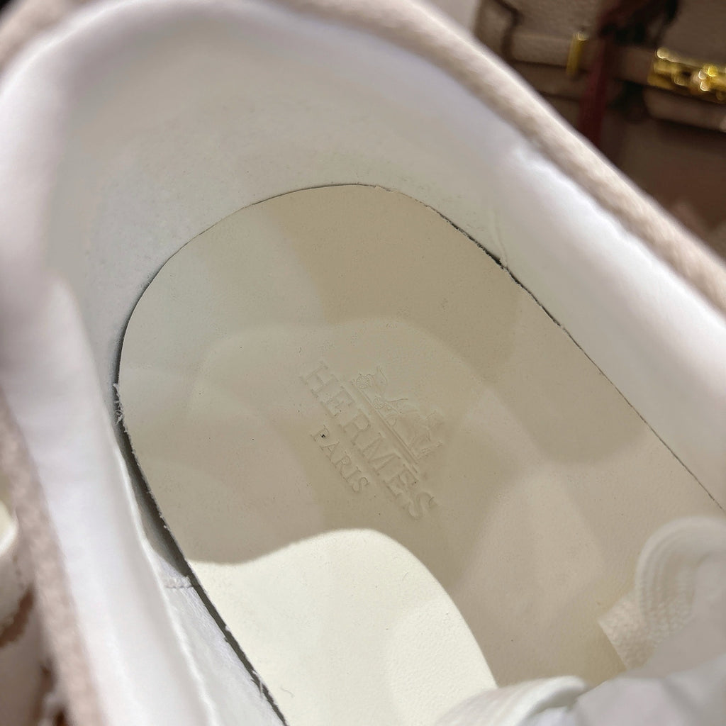 Hermes unisex sneaker insole close-up with embossed text