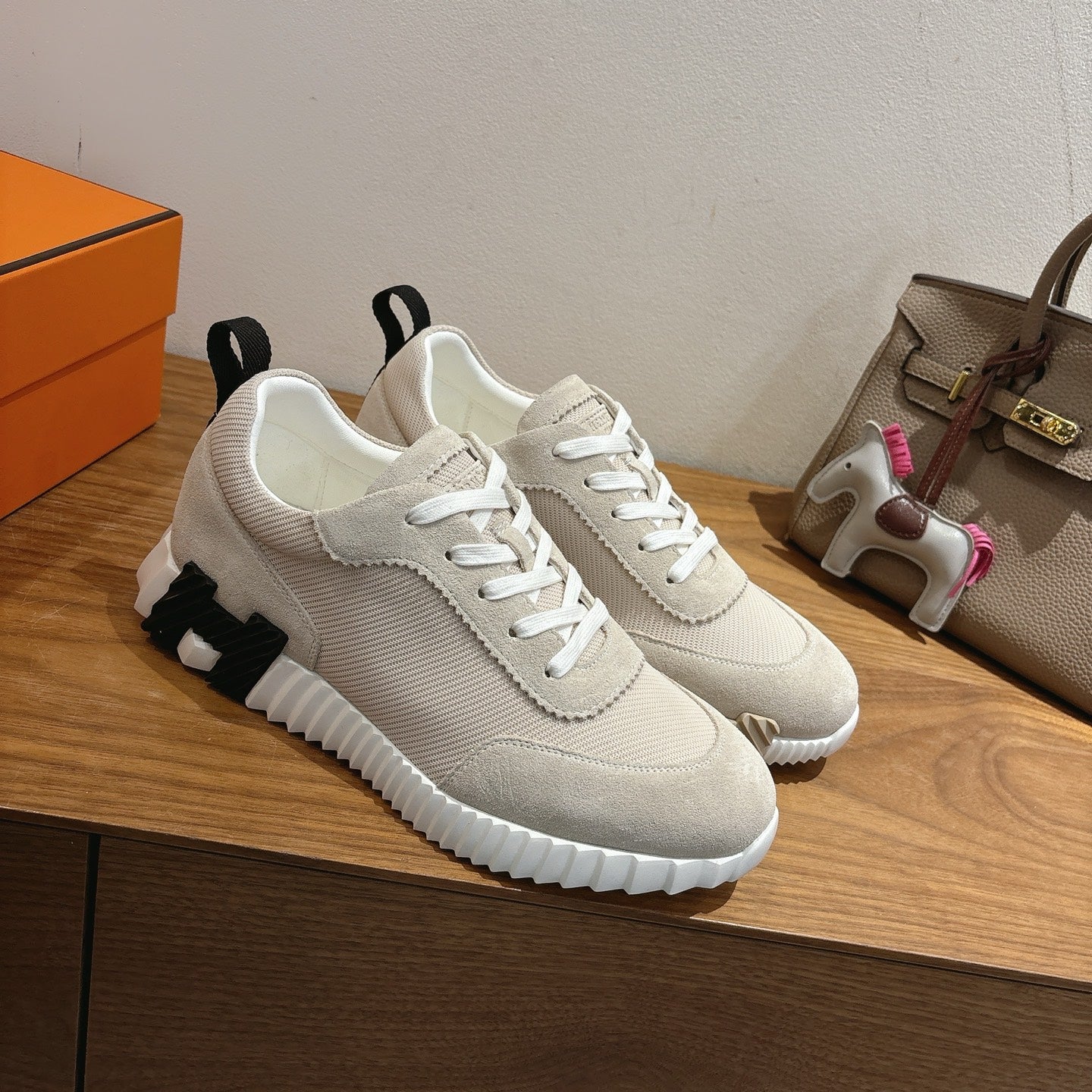 Hermes unisex sneakers, off-white knit upper with black logo patch and white laces