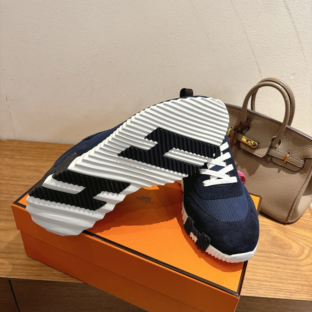 Hermes unisex sneakers, outsole view with white tread and black stripe detail