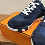 Hermes unisex sneakers, toe and lace-up close-up with white treaded sole