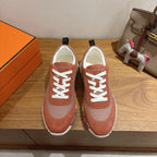 Unisex Hermes sneakers with white laces, brown suede and gray mesh, chunky white sole