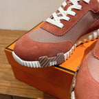 Hermes sneakers toe detail, brown suede and gray knit, white laces, ridged white outsole