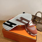 Hermes sneakers outsole view, chunky ridged tread, white sole with black accents