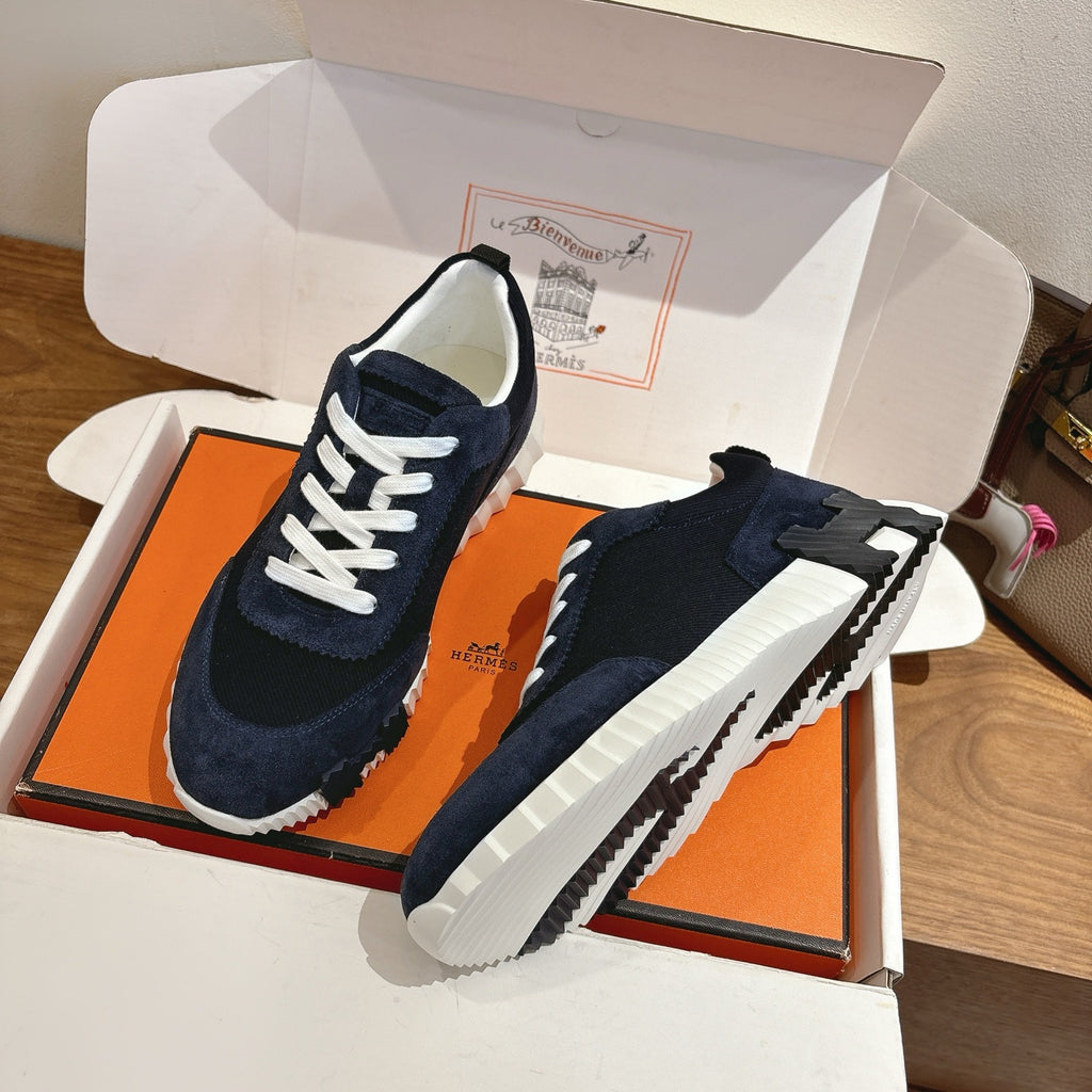 Unisex Hermes suede sneakers on box, dark navy upper, white laces, chunky white sole