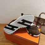 Hermes unisex sneakers, outsole view with black-and-white tread pattern