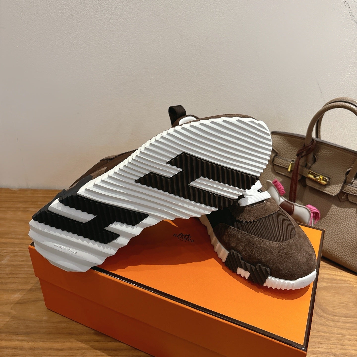 Hermes unisex sneakers, outsole view with black-and-white tread pattern
