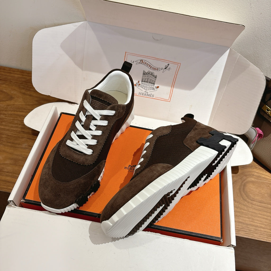 Hermes unisex sneakers, dark brown suede, side view with white laces and white rubber sole