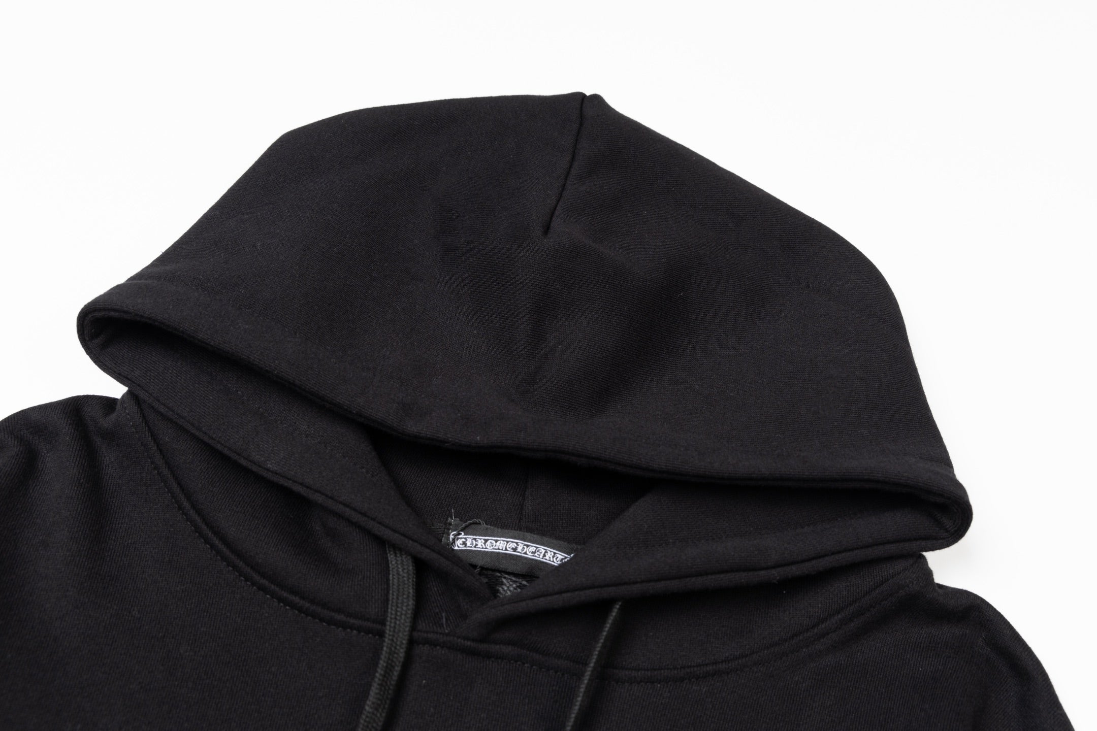 Black hoodie hood with stitched seam and front edge detail