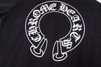 Black hoodie chest graphic close-up with circular text and central emblem