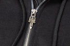 Silver zipper pull and teeth on black zip-up hoodie