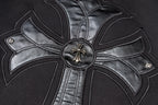 Black zip-up jacket with large chrome-style cross emblem and round metal button