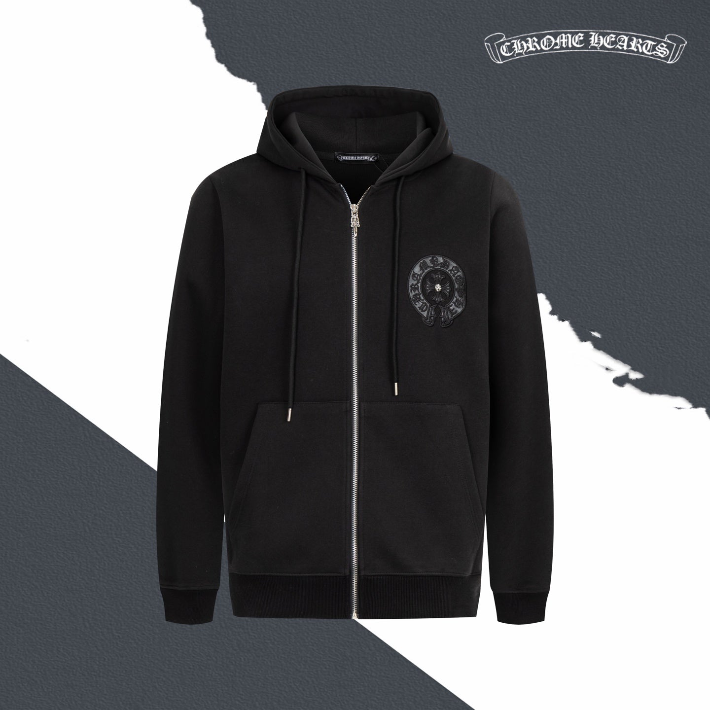 Black zip-up hoodie with hood, drawstrings, front pockets, and chest emblem patch