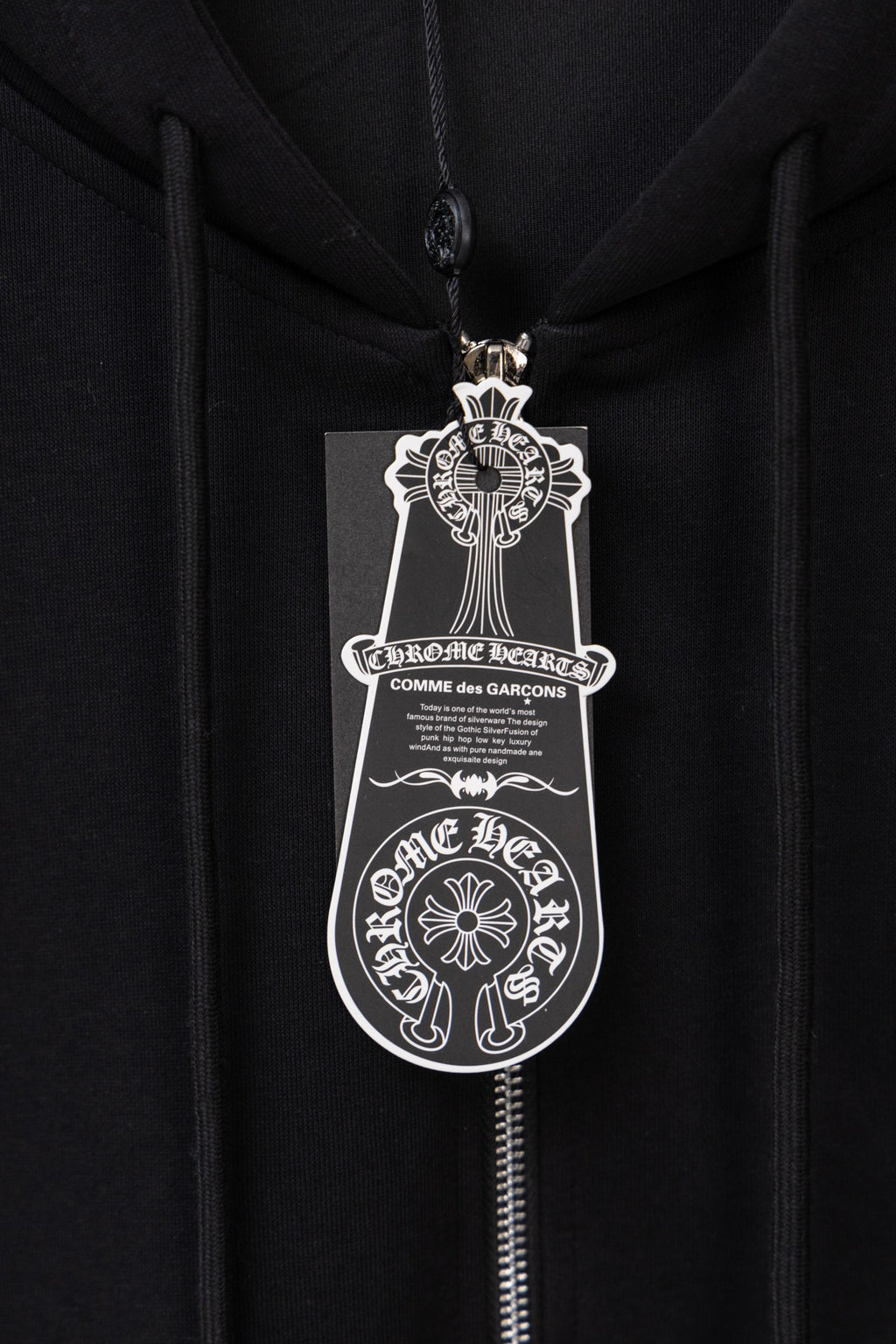 Black zip hoodie with front zipper and large logo crest graphic
