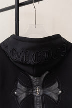 Black zip-up hoodie back view with embossed gothic lettering and large floral cross