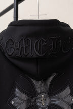 Black zip-up hoodie back close-up with large floral cross graphic and embossed text