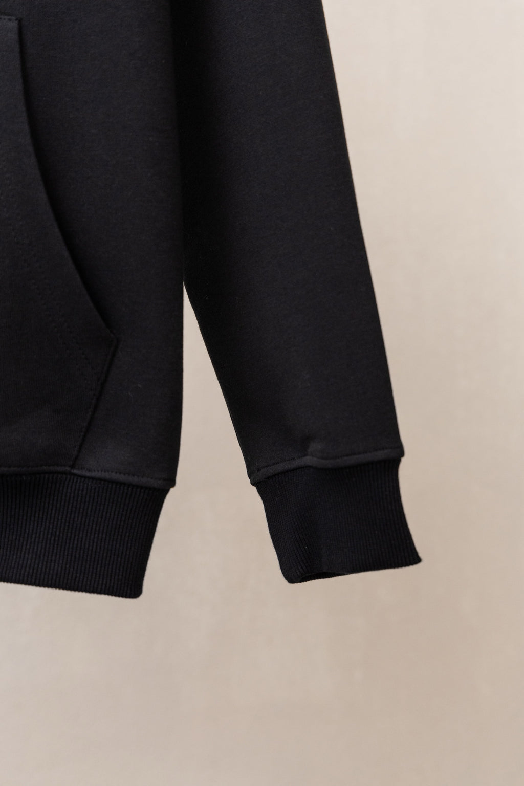 Black zip hoodie sleeves with ribbed cuffs