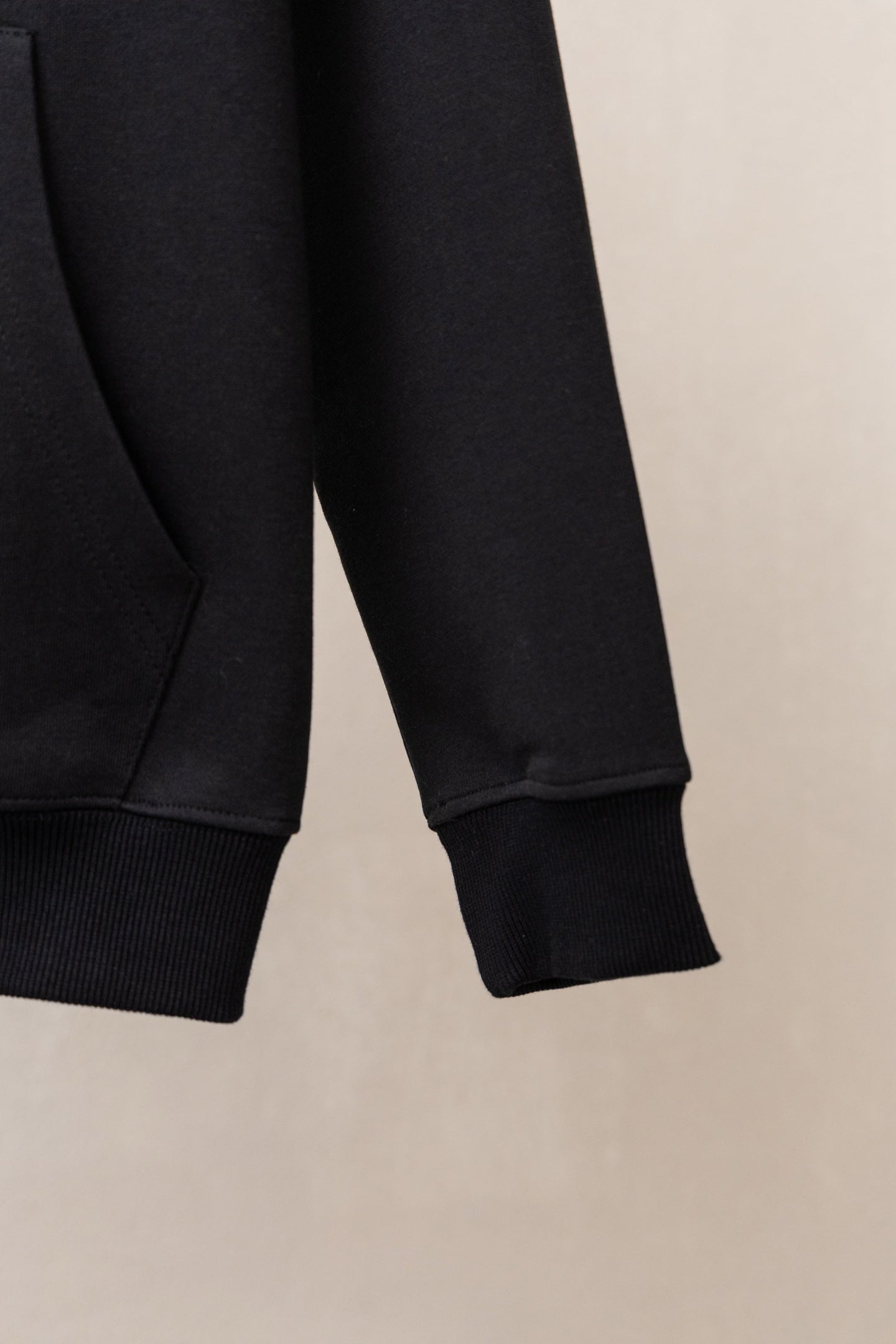 Black zip hoodie sleeves with ribbed cuffs