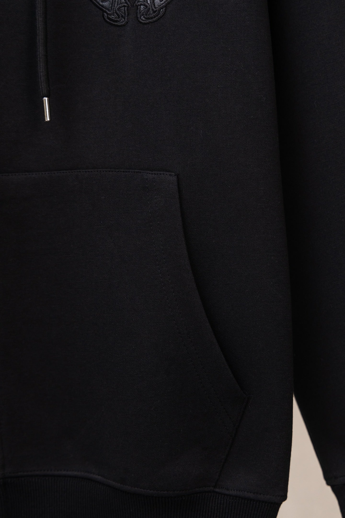 Black zip hoodie with kangaroo pocket and ribbed hem