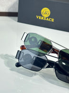 Sunglasses set with green and dark lenses, metal frames with bridge and temple details
